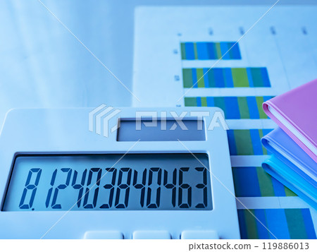 Graph, notebook and calculator on the table 119886013