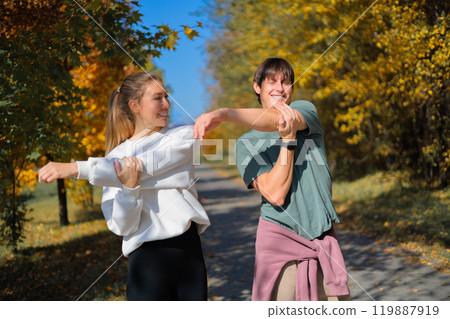 Cardio endurance exercises, use a fitness watch and an app. Runners athletes in fitness clothes.  119887919