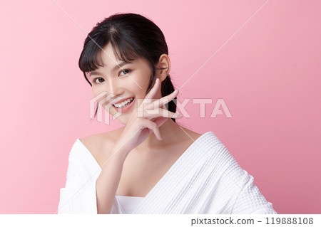 Beautiful young asian woman with clean fresh skin on pink background, Face care, Facial treatment, Cosmetology, beauty and spa, Asian women portrait. Beautiful young asian woman with clean fresh skin on pink background, Face care, Facial treatment, Cosmetology, beauty and spa, Asian women portrait. 119888108