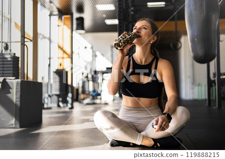 Athletic fitness woman stretching body at gym enjoy physical exercise activity Athletic fitness woman stretching body at gym enjoy physical exercise activity 119888215
