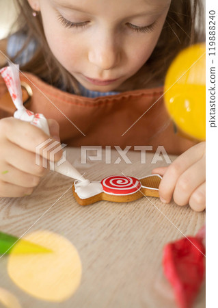 Happy family mother and children in aprons making Christmas cookies together while cooking 119888240