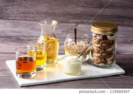 Various oils for cooking Various fats and oils on wood background Various oils for cooking Various fats and oils on wood background 119888407