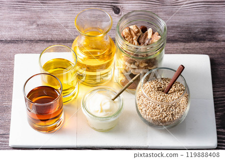 Various oils for cooking Various fats and oils Wood background Aerial view Various oils for cooking Various fats and oils Wood background Aerial view 119888408