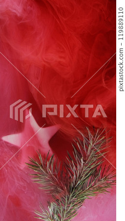 Christmas background. Mist fir sprig. Green tree plant star in red pink color paint water vapor cloud abstract texture with free space. 119889110