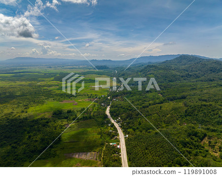 Tropical mountain road on countryside, green forest and vegetation. Mindanao, Philippines. Tropical mountain road on countryside, green forest and vegetation. Mindanao, Philippines. 119891008