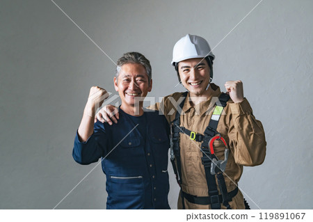 Smiling craftsmen and workers posing in a fist 119891067