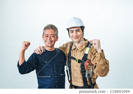 Smiling craftsmen and workers posing in a fist Smiling craftsmen and workers posing in a fist 119891094