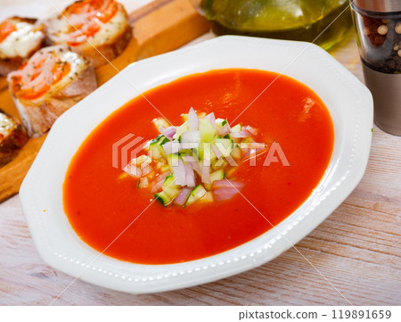 Andalusian cold soup gaspacho served with hot sandwiches 119891659