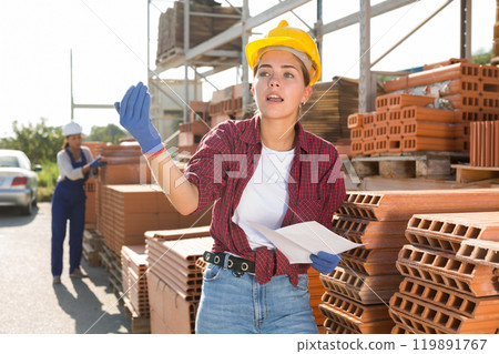 Female worker calling out for someone Female worker calling out for someone 119891767
