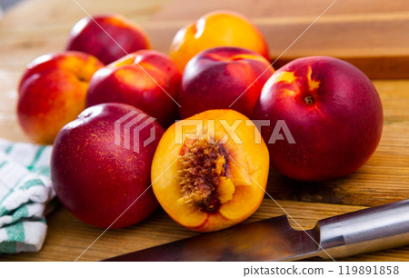 Ripe fresh juicy nectarines on wooden background, harvest season 119891858