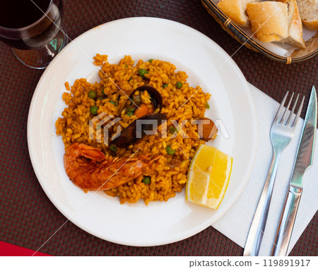 Portion of freshly made paella with seafoods 119891917