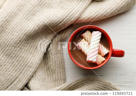 Cup of delicious hot chocolate on wooden table background. 119893721