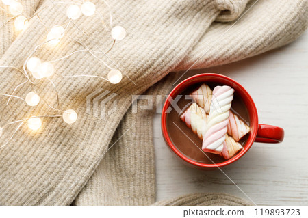 Cup of delicious hot chocolate on wooden table background. Cup of delicious hot chocolate on wooden table background. 119893723