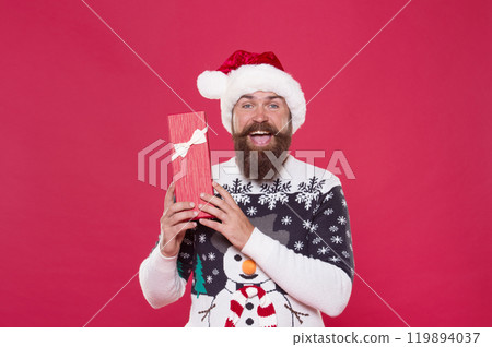 Christmas gift concept. Man celebrate winter holiday. Hipster in winter sweater. Winter season holidays. Box in his hands. Santa gave me present. Joyful shopping. Favorite tradition. Happy new year Christmas gift concept. Man celebrate winter holiday. Hipster in winter sweater. Winter season holidays. Box in his hands. Santa gave me present. Joyful shopping. Favorite tradition. Happy new year 119894037