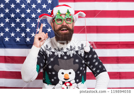 Where liberty dwells. Happy new year. Happy guy celebrate xmas and new year. Bearded hipster man happy smiling american flag background. Happy holidays. Merry Christmas. Holiday season in USA 119894038