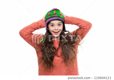 Teen girl in earflap hat. Winter fashion style. Girl in knitwear. Portrait of teen child wearing warm winter clothes. Girl kid wear warm hat isolated on white. Happy childhood. Winter fashion trends 119894121