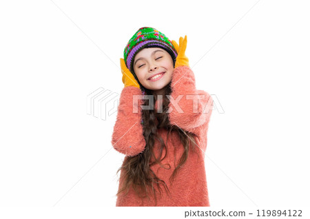 Girl kid wear warm hat isolated on white. Happy childhood. Teen girl in earflap hat. Winter fashion style. Girl in knitwear. Portrait of teen child wearing winter clothes. Winter fashion essentials 119894122