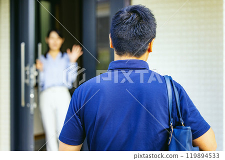 Couple waving at the front door Couple waving at the front door 119894533