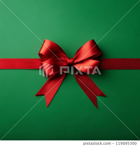 綠色背景上的紅色絲帶。聖誕禮物的圖片。 119895300