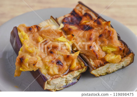 Grilled eggplant with green onion, miso and cheese Grilled eggplant with green onion, miso and cheese 119898475