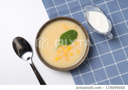 Corn soup in a plate, on a white background. Corn soup in a plate, on a white background. 119899088