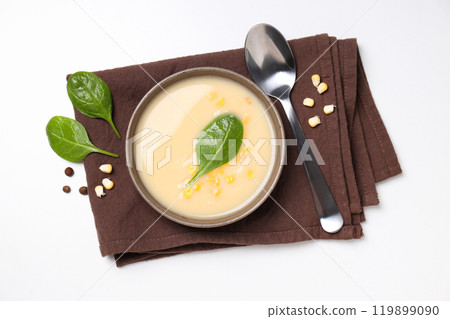Corn soup in a plate, on a white background. Corn soup in a plate, on a white background. 119899090