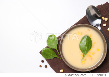 Corn soup in a plate, on a white background. Corn soup in a plate, on a white background. 119899091
