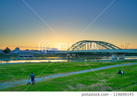 View of Tama Aqueduct and Tama Ward, Kawasaki City from the Tama River riverbed in Komae City, Tokyo on an autumn evening View of Tama Aqueduct and Tama Ward, Kawasaki City from the Tama River riverbed in Komae City, Tokyo on an autumn evening 119899145