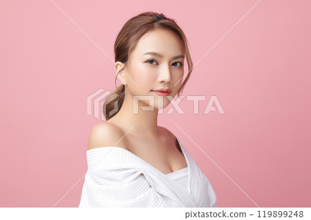 Beautiful young asian woman with clean fresh skin on pink background, Face care, Facial treatment, Cosmetology, beauty and spa, Asian women portrait. Beautiful young asian woman with clean fresh skin on pink background, Face care, Facial treatment, Cosmetology, beauty and spa, Asian women portrait. 119899248