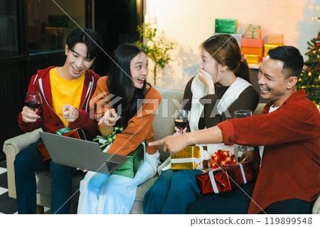 drinks and conversation, social gathering and get together at New Year young people, group and gift exchange at the event, celebration at home. 119899548