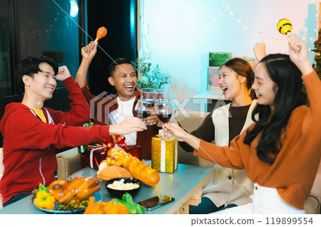 drinks and conversation, social gathering and get together at New Year young people, group and gift exchange at the event, celebration at home. drinks and conversation, social gathering and get together at New Year young people, group and gift exchange at the event, celebration at home. 119899554