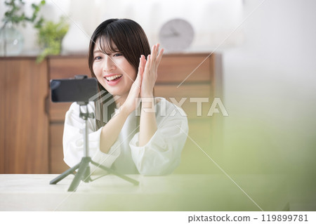 Image of a video distributor filming Thank you for the tip ~ A cute young woman clapping towards the camera as a fan service 119899781