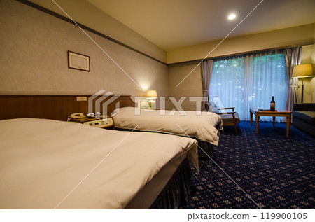 Resort hotel guest room, twin room, welcome wine on the table Resort hotel guest room, twin room, welcome wine on the table 119900105