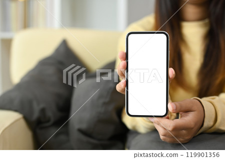 Close up of hands presenting a blank screen on smartphone for digital content Close up of hands presenting a blank screen on smartphone for digital content 119901356