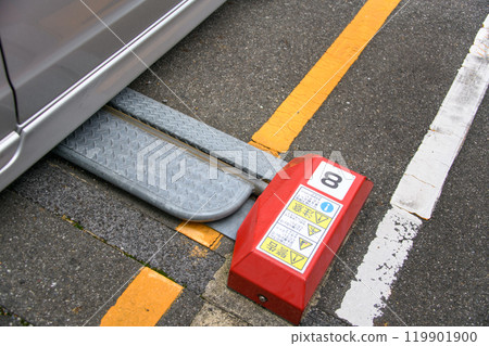 The lock plate of a coin parking lot in the lowered position The lock plate of a coin parking lot in the lowered position 119901900
