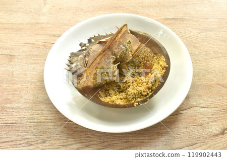 spicy and sour sea horseshoe crab egg wiith slice vegetable salad Thai food on plate 119902443