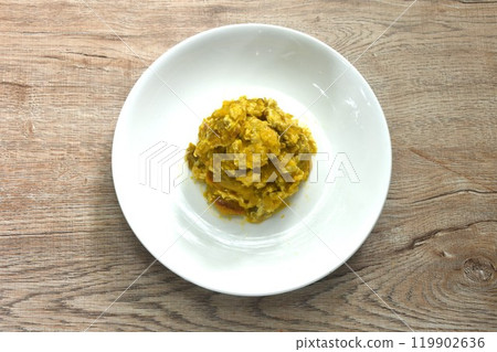 stir fried pumpkin mixed with egg on plate 119902636