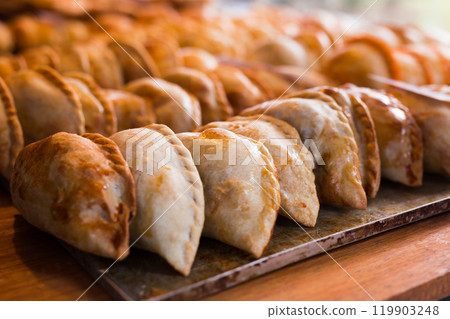 Freshly baked empanadas with different fillings for sale Freshly baked empanadas with different fillings for sale 119903248