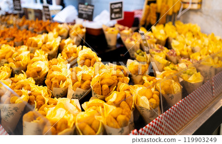 Tasty crispy chicken nuggets in a paper cones. Paper Cones containing chicken on sale at the local city Market or supermarket 119903249