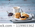Cream tea with scones, afternoon tea, milk tea, jam on top, blue wood background 3 119903362
