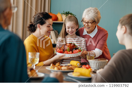Family celebrating Thanksgiving Day Family celebrating Thanksgiving Day 119903792