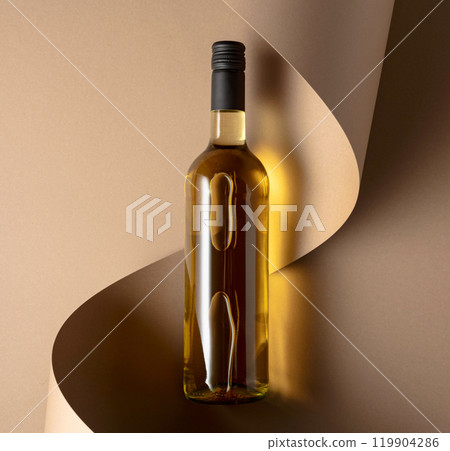 Bottle of white wine on a beige background. 119904286