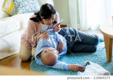 A collapsed senior man and his worried wife A collapsed senior man and his worried wife 119904377