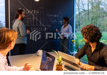 In a contemporary work setting, a team works together to devise strategies using visual information 119904516