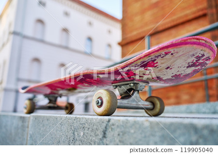 Close-Up of Worn Skateboard at city street 119905040