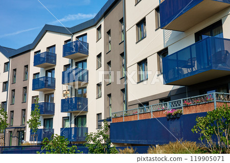 Residential building facade with balconies at summer day Residential building facade with balconies at summer day 119905071