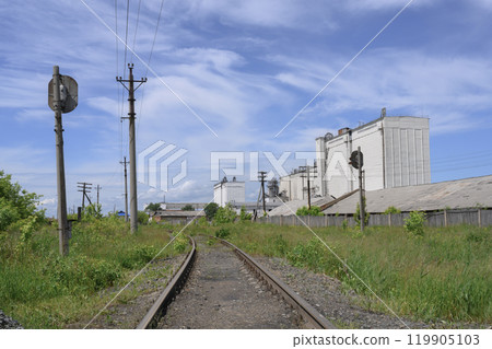 The old railway on the industrial outskirts of the city in summer The old railway on the industrial outskirts of the city in summer 119905103