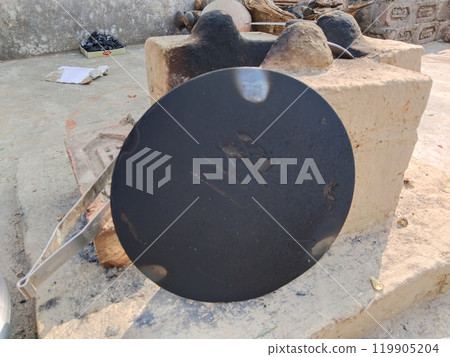 roti maker tawa stand besides rural kitchen. Traditional stoves used by residents in rural India, pakistan, Bangladesh, nepal, afganistan, Sri Lanka and undeveloped countries. made of clay, fueled 119905204