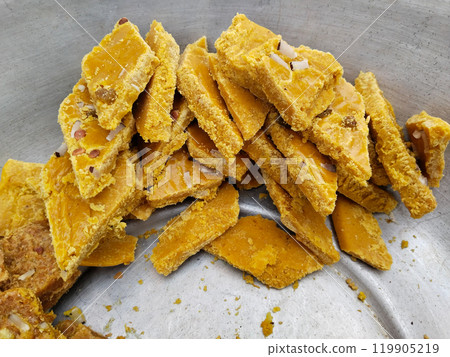 halwa making by indian muslim for shab e barat festival. Moong Dal Besan Burfi is made with roasted moong dal or yellow lentil, chickpea flour, ghee, khoya or mawa and sugar syrup, Indian sweet or 119905219