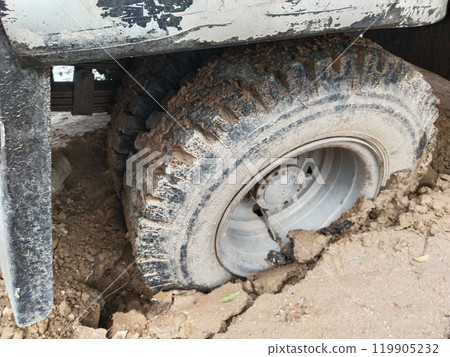 Close up of the wheel which got stuck in muddy dirt. Torsion on high turns. Close up of the wheel which got stuck in muddy dirt. Torsion on high turns. 119905232